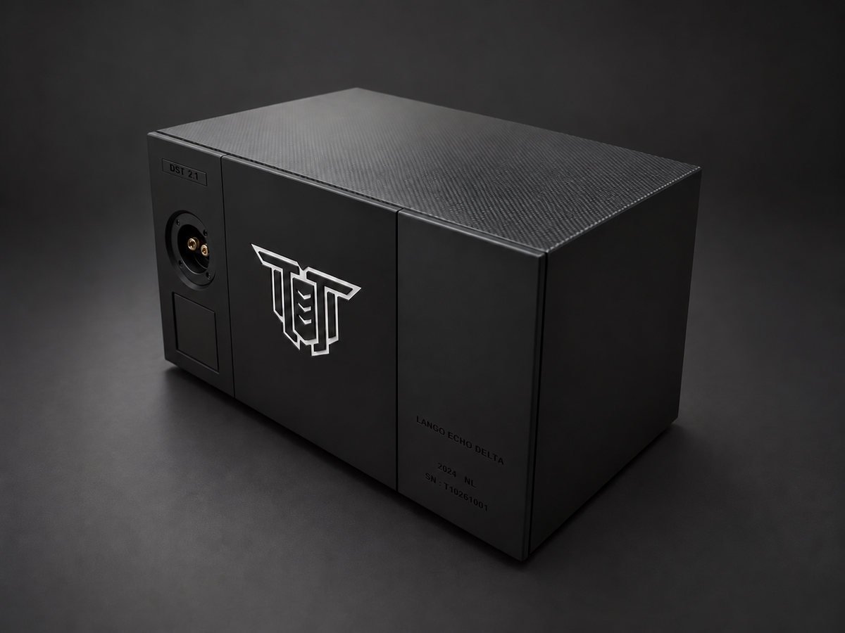 Prototype seen at an angle from the rear: terminals and nameplate on the left, the logo in the centre, a carbon-pattern top.